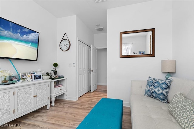 living room with light hardwood / wood-style floors