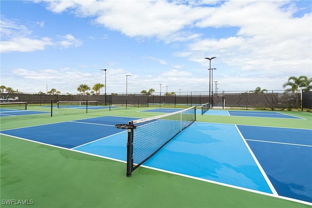 view of tennis court featuring basketball court