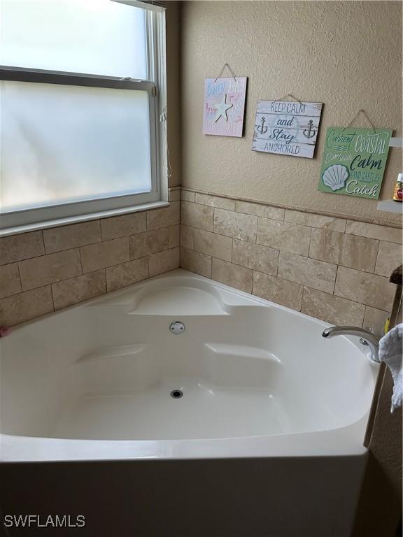 bathroom with a bathing tub