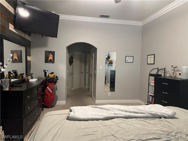 carpeted bedroom with ornamental molding