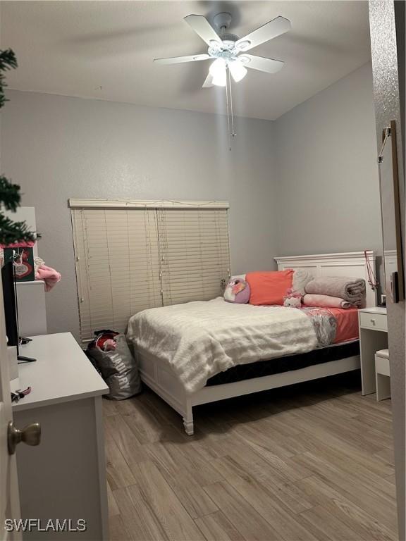 bedroom featuring ceiling fan and light wood-type flooring