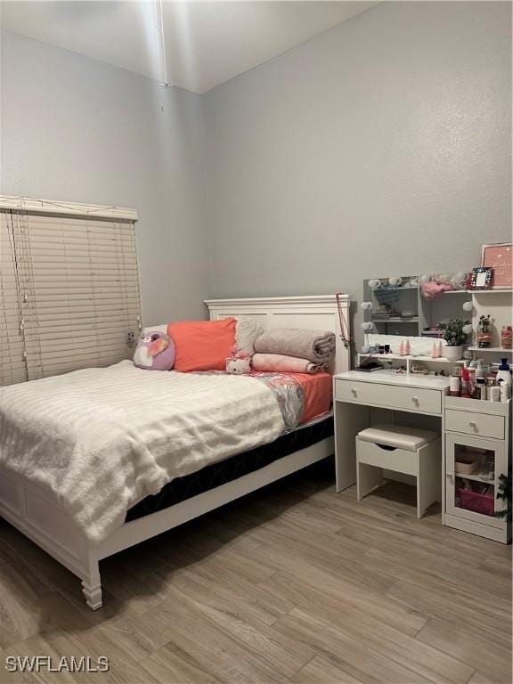 bedroom with light wood-type flooring