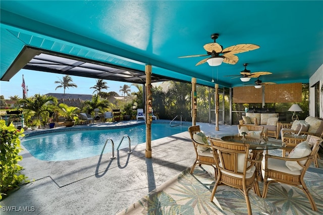 outdoor pool with a patio and ceiling fan