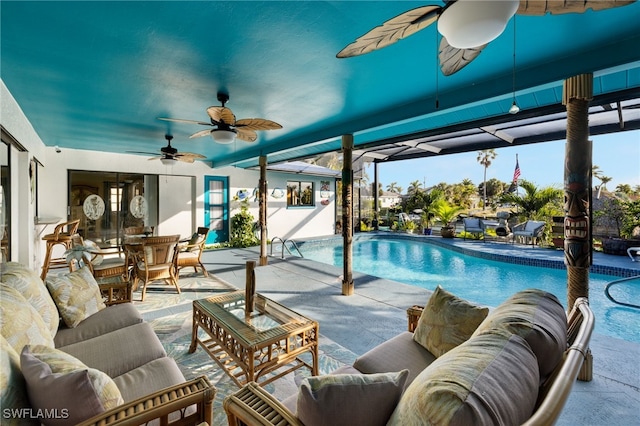 pool featuring a ceiling fan, outdoor lounge area, and a patio