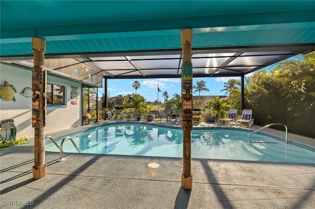 outdoor pool with a patio and a lanai