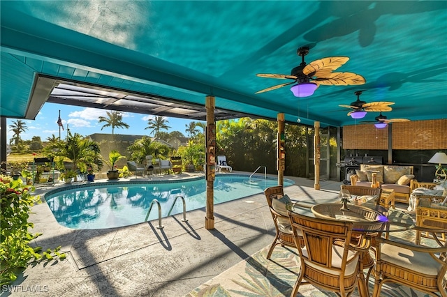 pool with ceiling fan and a patio