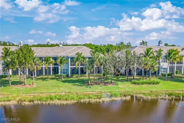 9275 Museo Cir Unit 103, Naples, FL 34114 - back of house featuring a water view and a yard