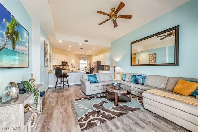 9275 Museo Cir Unit 103, Naples, FL 34114 - living room featuring light wood finished floors, visible vents, recessed lighting, and a ceiling fan