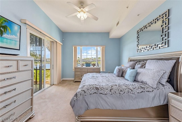 carpeted bedroom featuring ceiling fan and access to outside