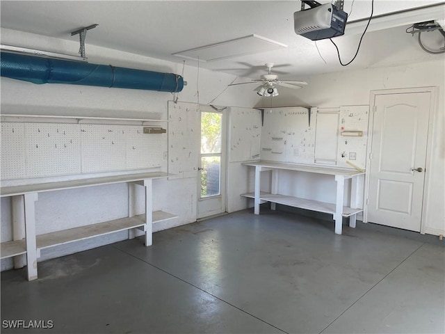 garage featuring ceiling fan, a workshop area, and a garage door opener