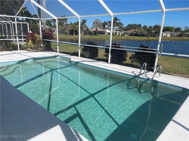 view of pool with a lanai and a water view