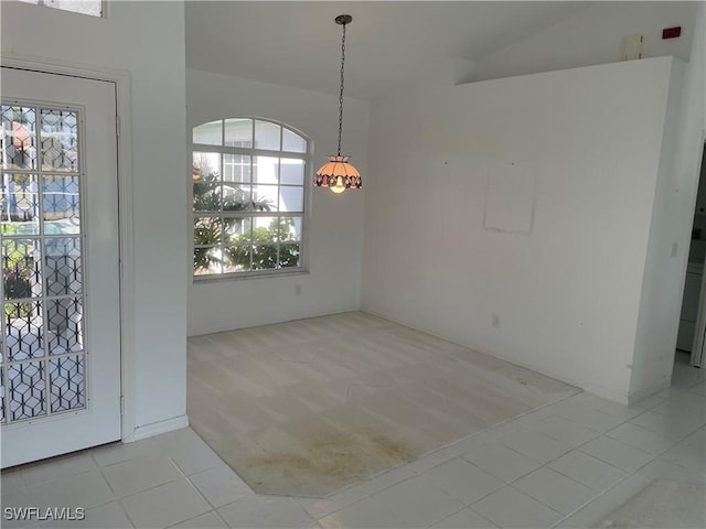 unfurnished dining area with light tile patterned floors