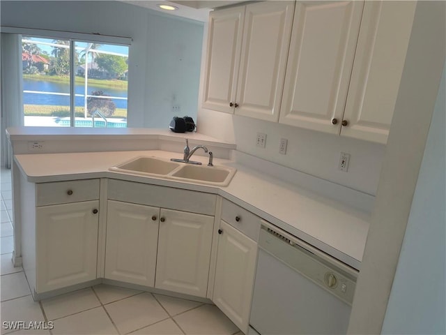 kitchen featuring dishwasher, white cabinetry, sink, a water view, and light tile patterned floors