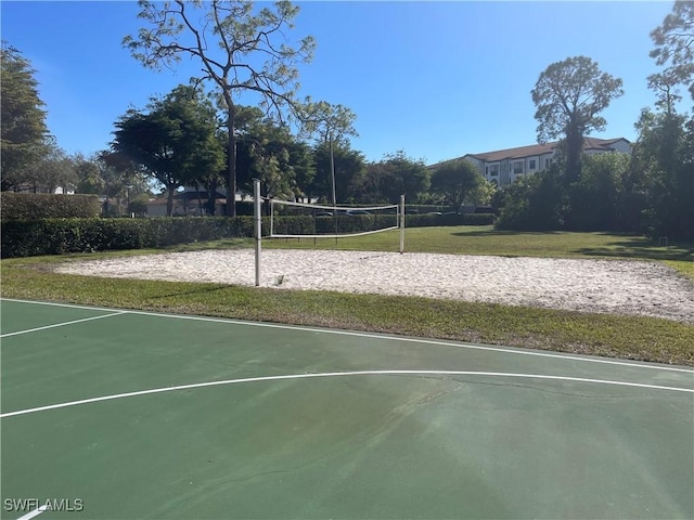 view of home's community featuring a lawn and volleyball court