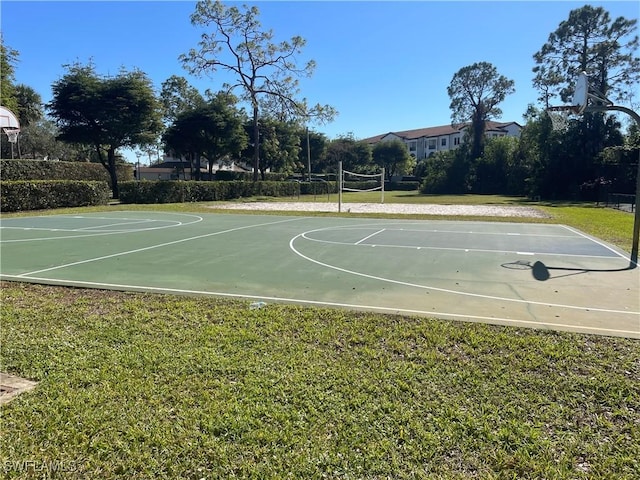 view of sport court with volleyball court and a yard