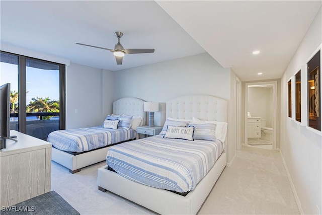 carpeted bedroom featuring access to outside, connected bathroom, and ceiling fan