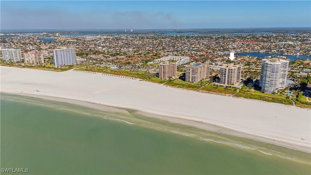 birds eye view of property featuring a view of the beach and a water view