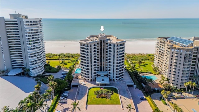 aerial view featuring a water view and a beach view