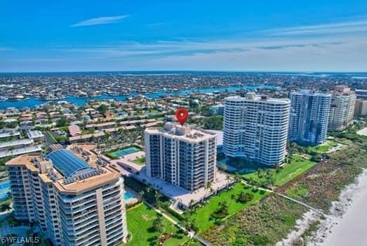 bird's eye view featuring a city view and a water view