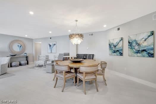 dining area featuring baseboards, visible vents, a chandelier, and recessed lighting