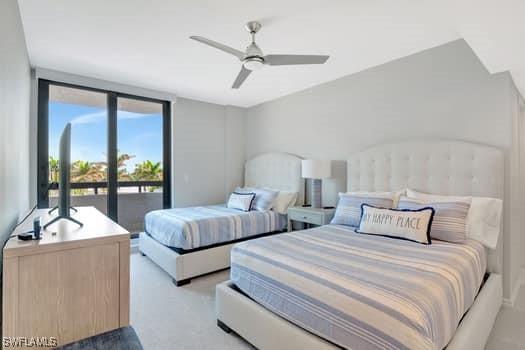 bedroom featuring access to outside, ceiling fan, and light colored carpet