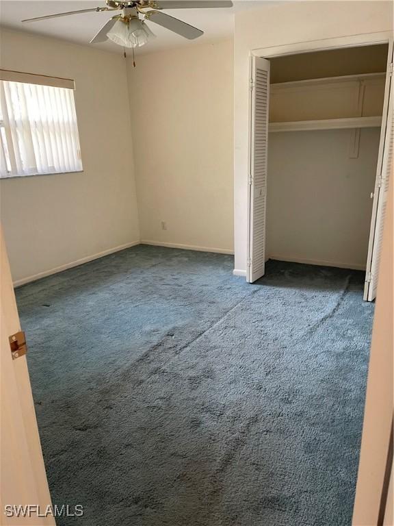 unfurnished bedroom with carpet floors and ceiling fan