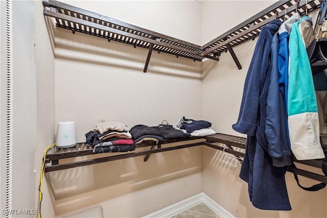 walk in closet featuring tile patterned floors