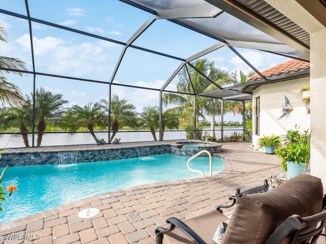 view of pool with an in ground hot tub, a lanai, pool water feature, and a patio area