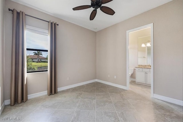 spare room with light tile patterned flooring and ceiling fan