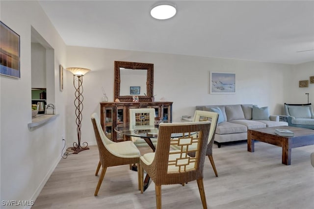 dining space featuring light hardwood / wood-style floors