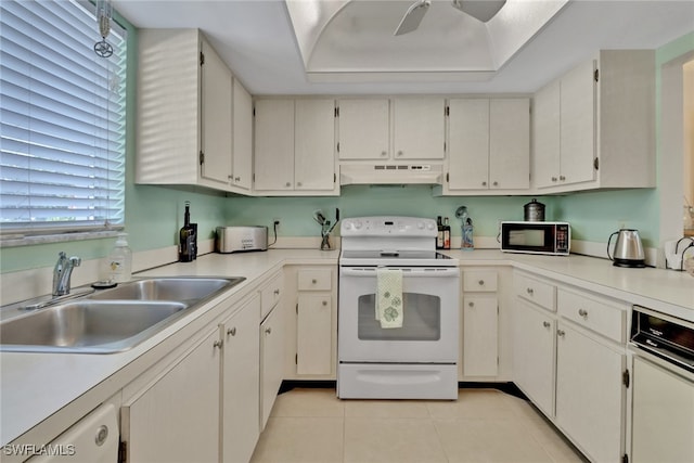 kitchen featuring light tile patterned floors, white appliances, white cabinetry, and sink