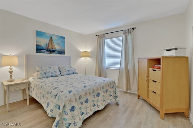 bedroom with light hardwood / wood-style floors