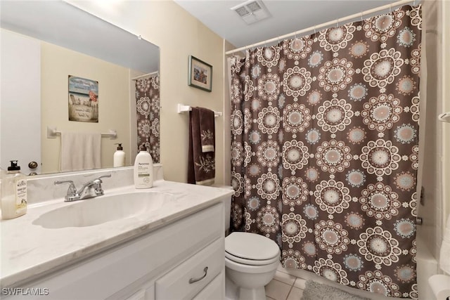 bathroom featuring tile patterned flooring, vanity, a shower with shower curtain, and toilet