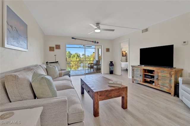 living room with ceiling fan and light hardwood / wood-style floors