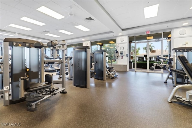 exercise room featuring a paneled ceiling