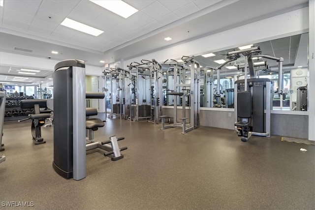 workout area featuring a paneled ceiling