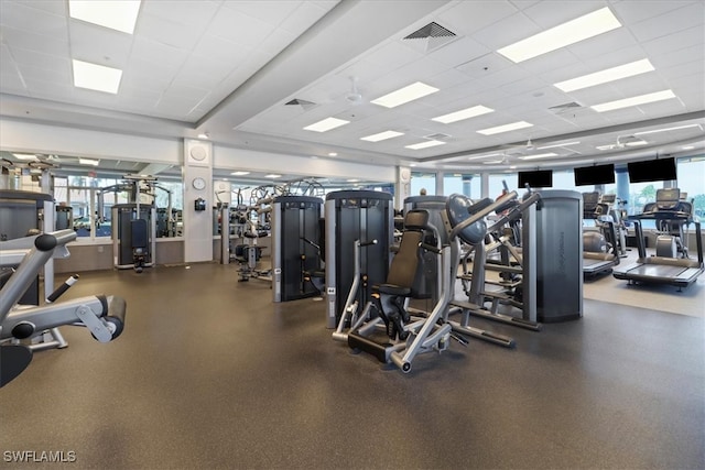 gym featuring a drop ceiling