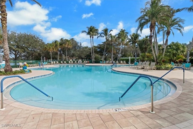 community pool featuring a patio area