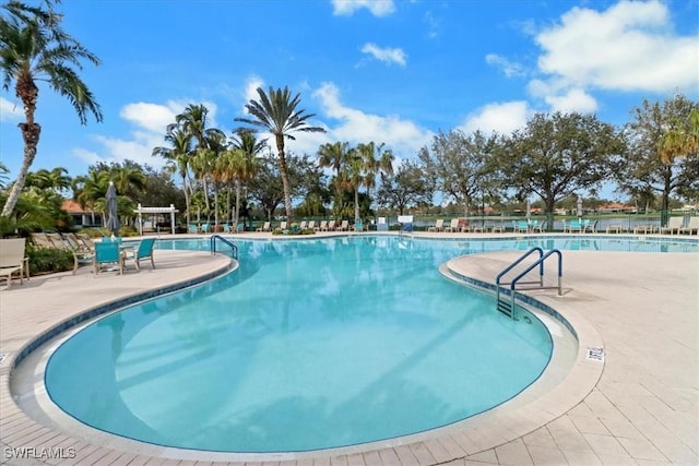 community pool featuring a patio area