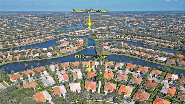 birds eye view of property featuring a water view and a residential view