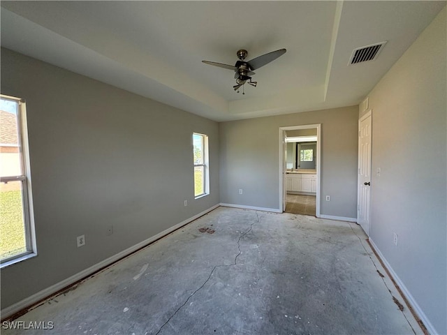 unfurnished bedroom with connected bathroom and ceiling fan