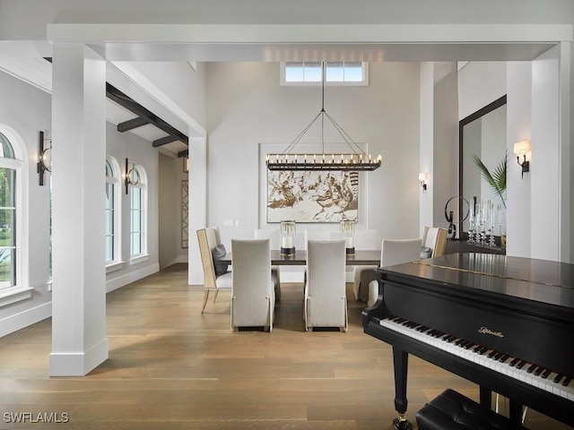 misc room featuring hardwood / wood-style floors and a notable chandelier