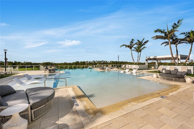 view of swimming pool featuring a patio area