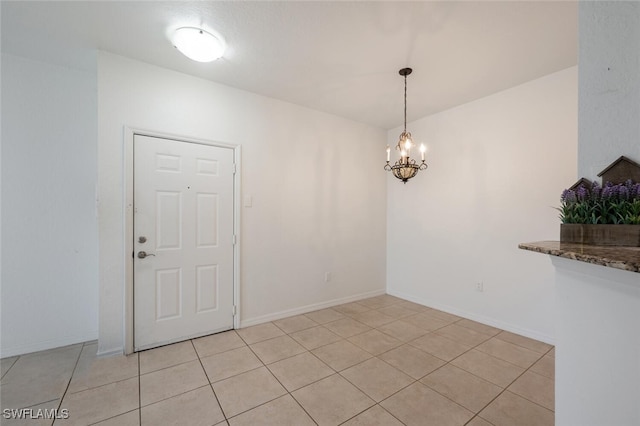 unfurnished dining area with light tile patterned flooring and a chandelier