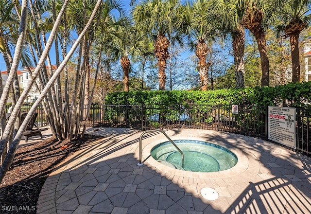 view of pool featuring a community hot tub and a patio