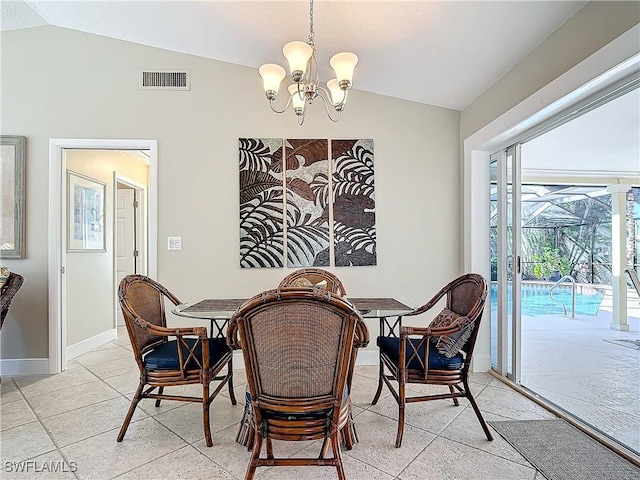 tiled dining room with vaulted ceiling and a notable chandelier