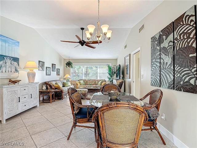 dining area with ceiling fan with notable chandelier, lofted ceiling, and light tile patterned floors