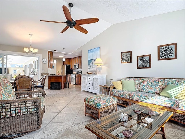 tiled living room with ceiling fan with notable chandelier, lofted ceiling, and a textured ceiling