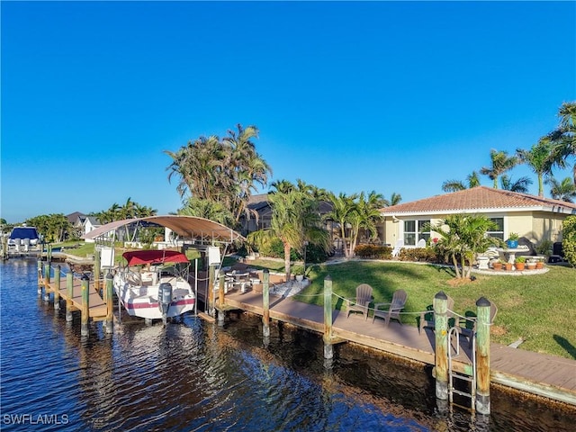 view of dock featuring a lawn and a water view