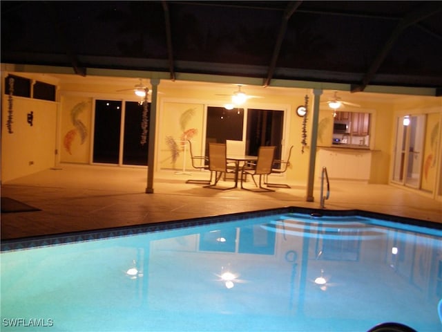 view of pool with a patio area, ceiling fan, and a lanai